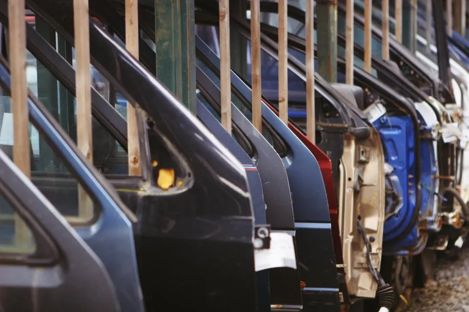 Vehicle doors lined up on an assembly line